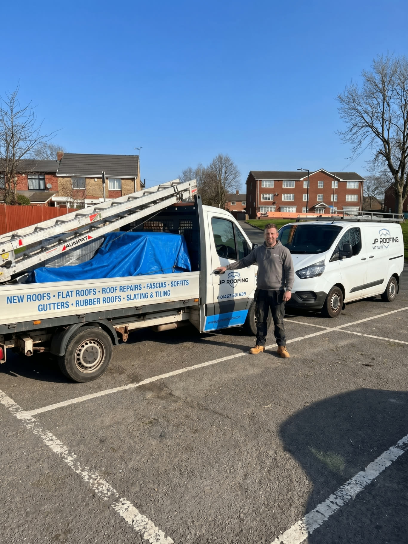 John and team of JP Roofing with company van