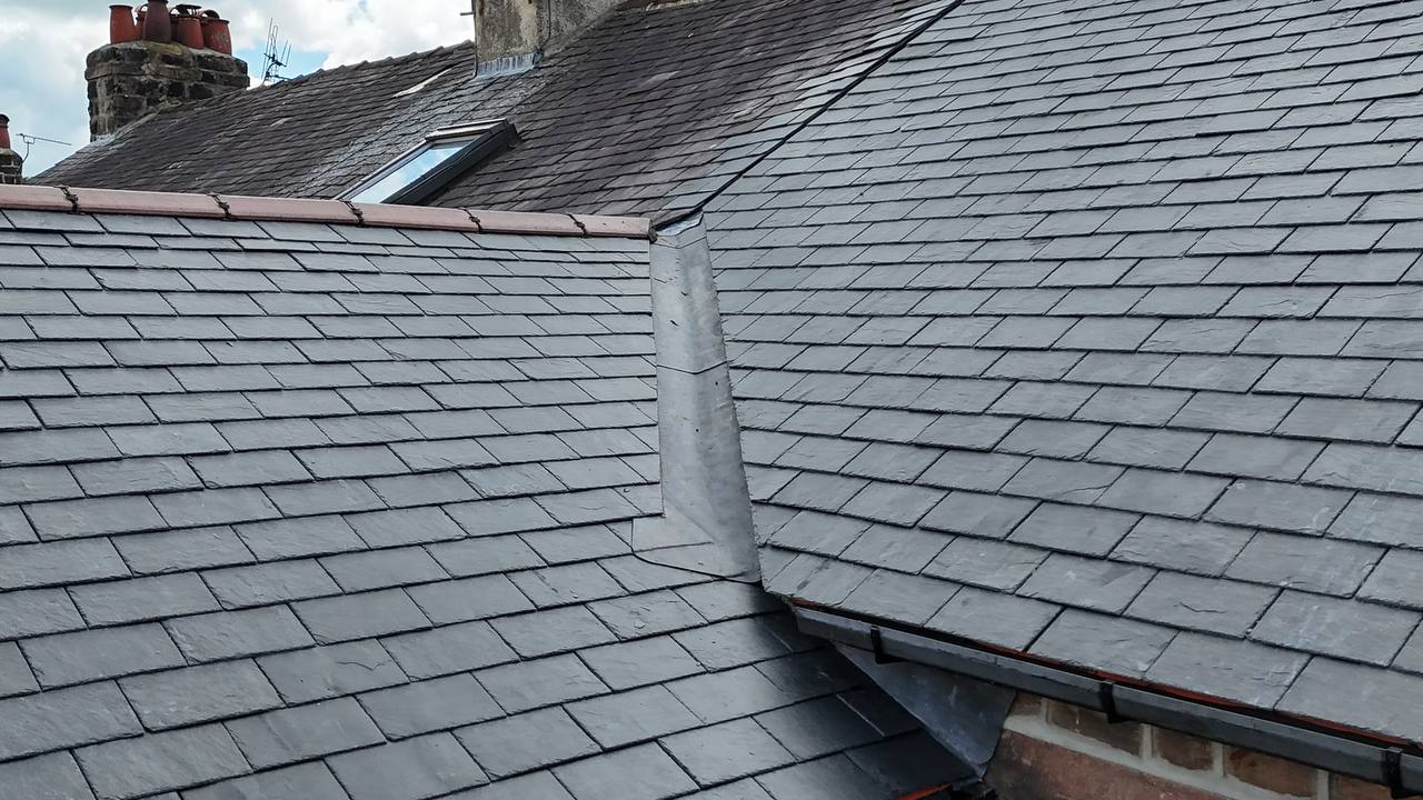 JP Roofing van on site with new tiled roof